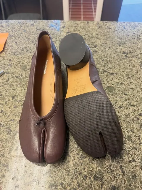 Burgundy Tabi flats with protective taupe soles fitted to the bottoms