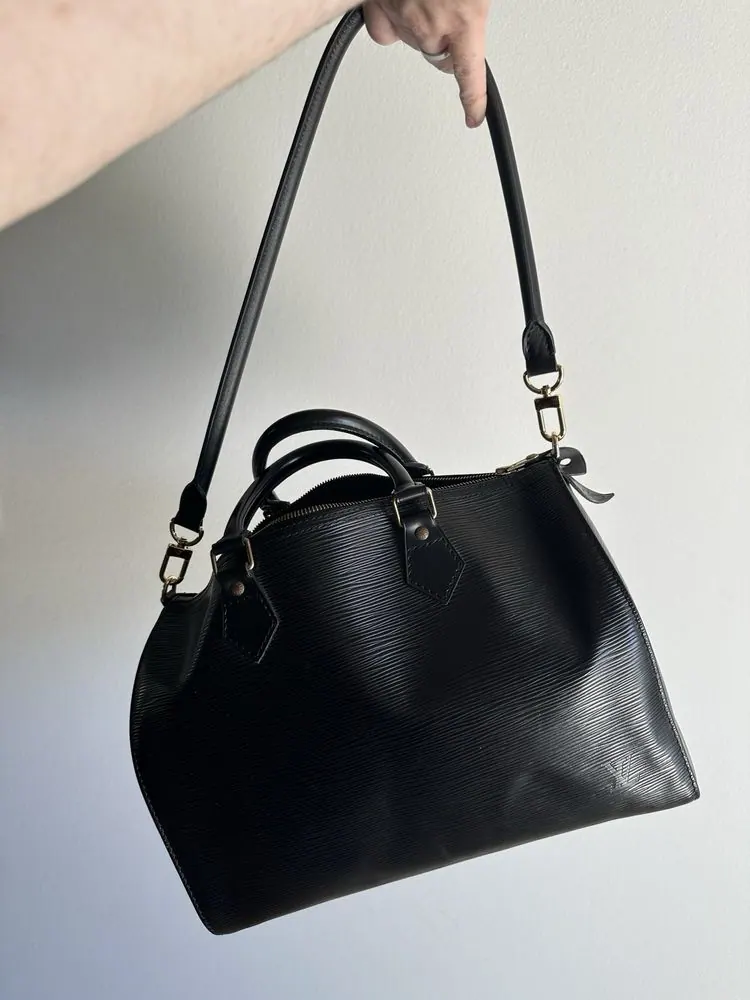 A vintage Louis Vuitton Speedy fitted with D-rings for a shoulder strap