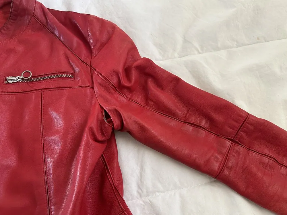 A red leather jacket with the left underarm sewn