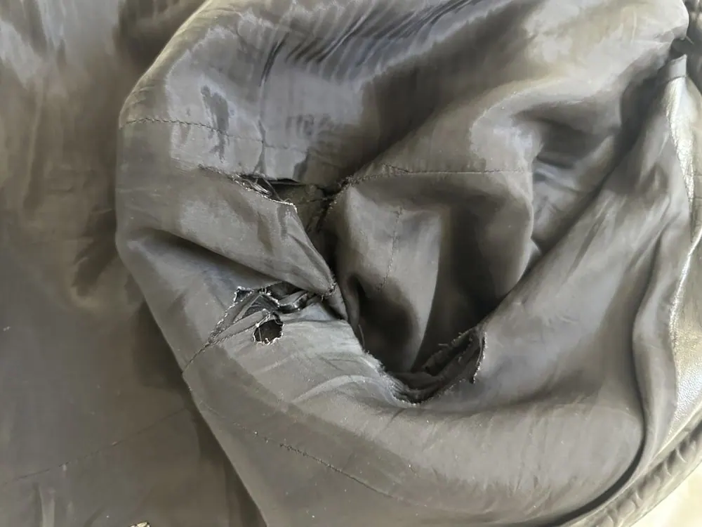 Interior stitching on a Prada leather jacket