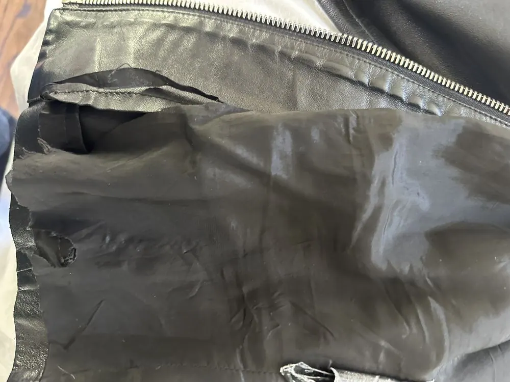 Stitching detail inside a Prada leather jacket
