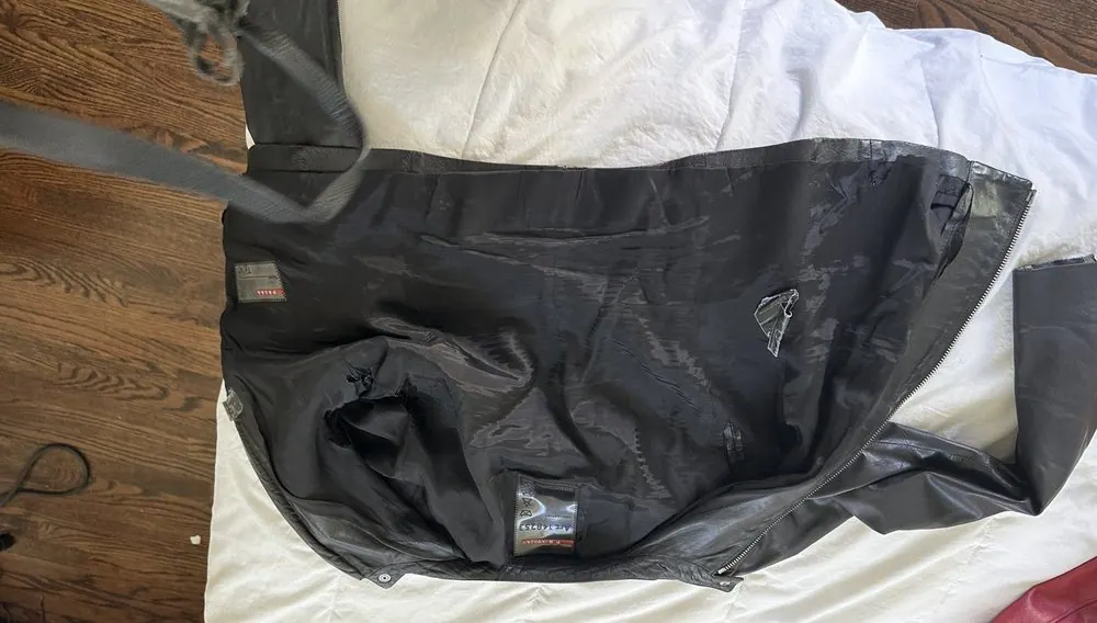 Inside seam repair on a Prada leather jacket