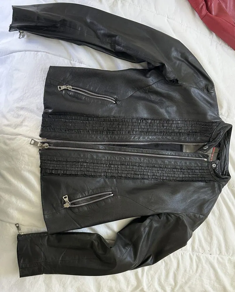 A black Prada leather jacket in for an underarm and interior seam