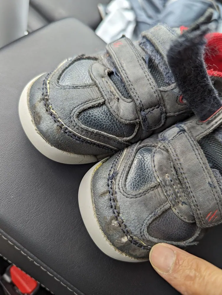 A glued and stitched toe where the stitching had broken and the toe was opening up