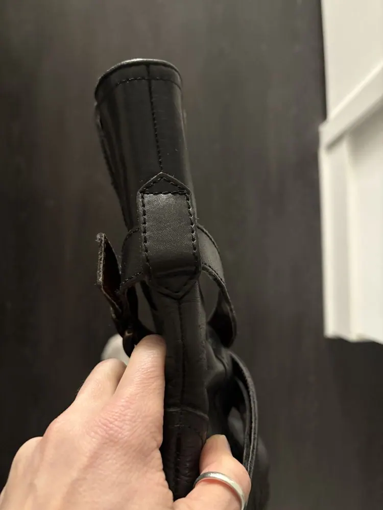 Restitched leather on a boot
